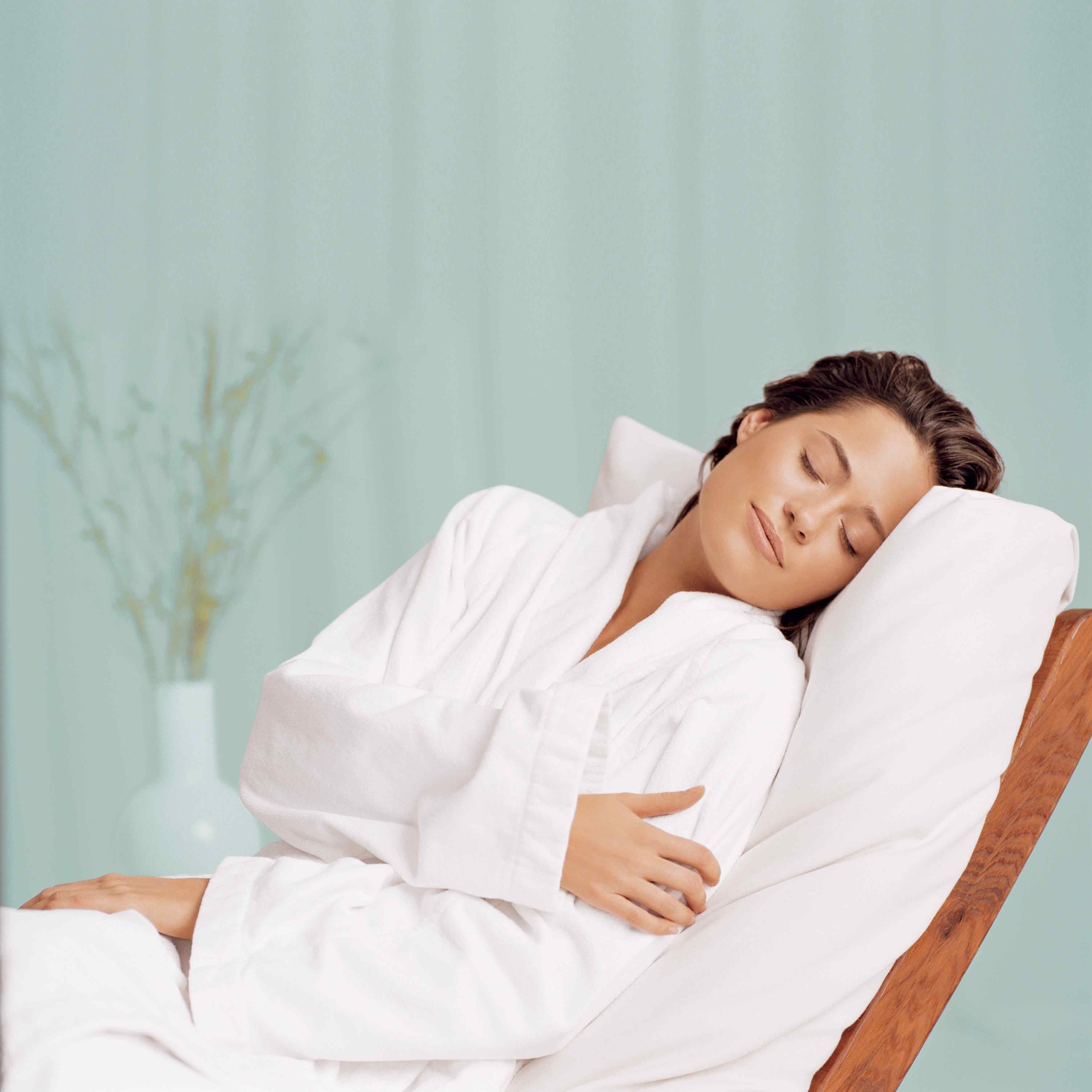 Woman relaxing on a lounger at the Vale Spa