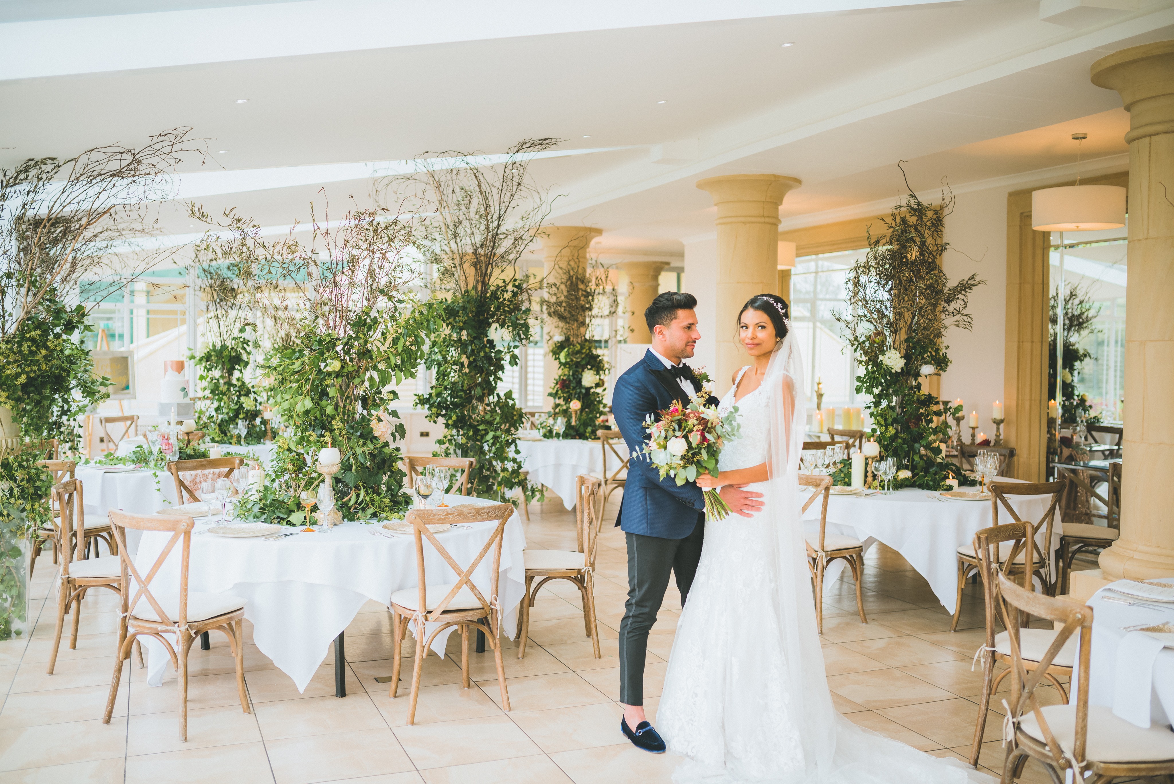 Bride and Groom in conservatory set up for wedding 