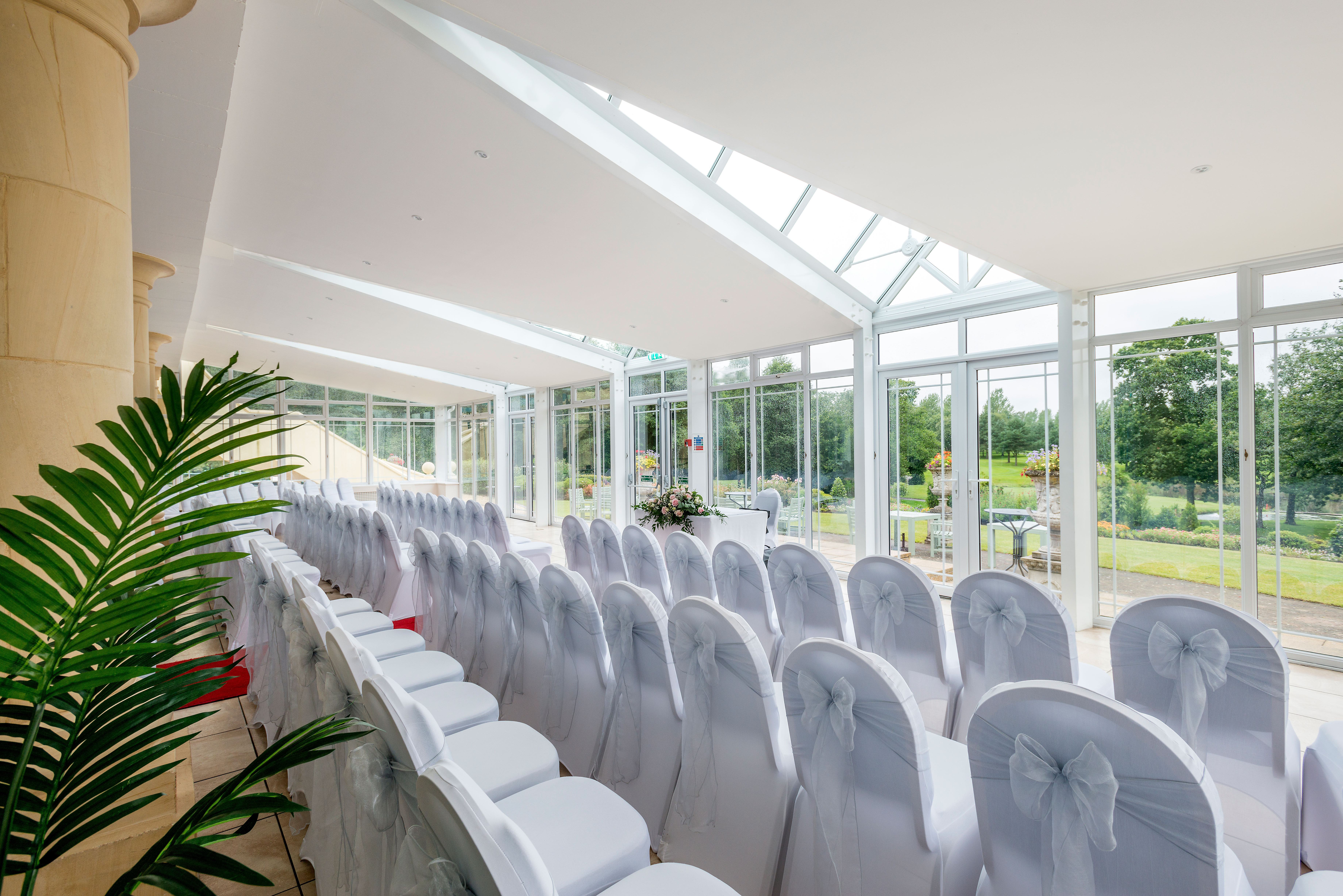Conservatory wedding set up with view of golf course