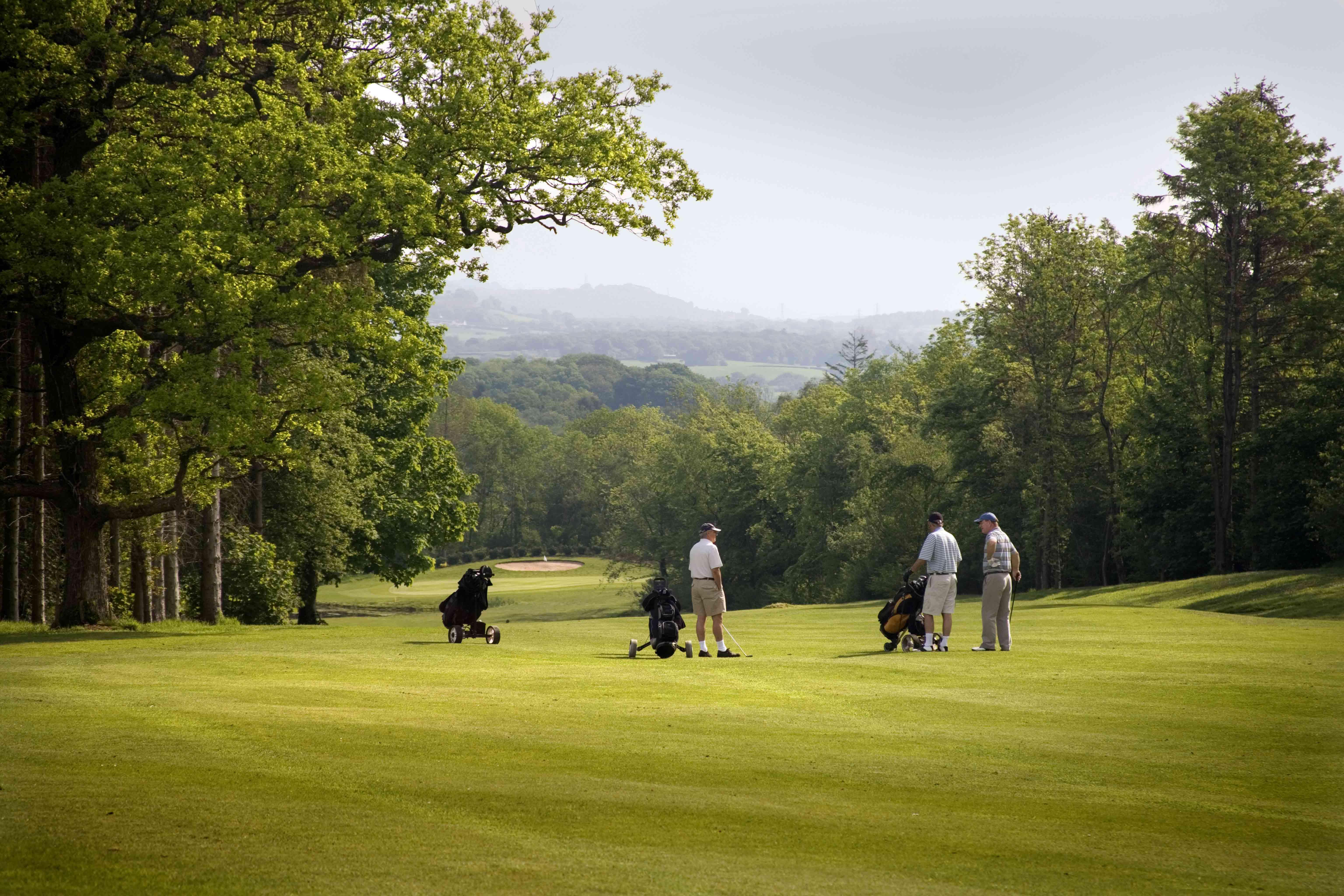Golfers chatting on the Wales National Course