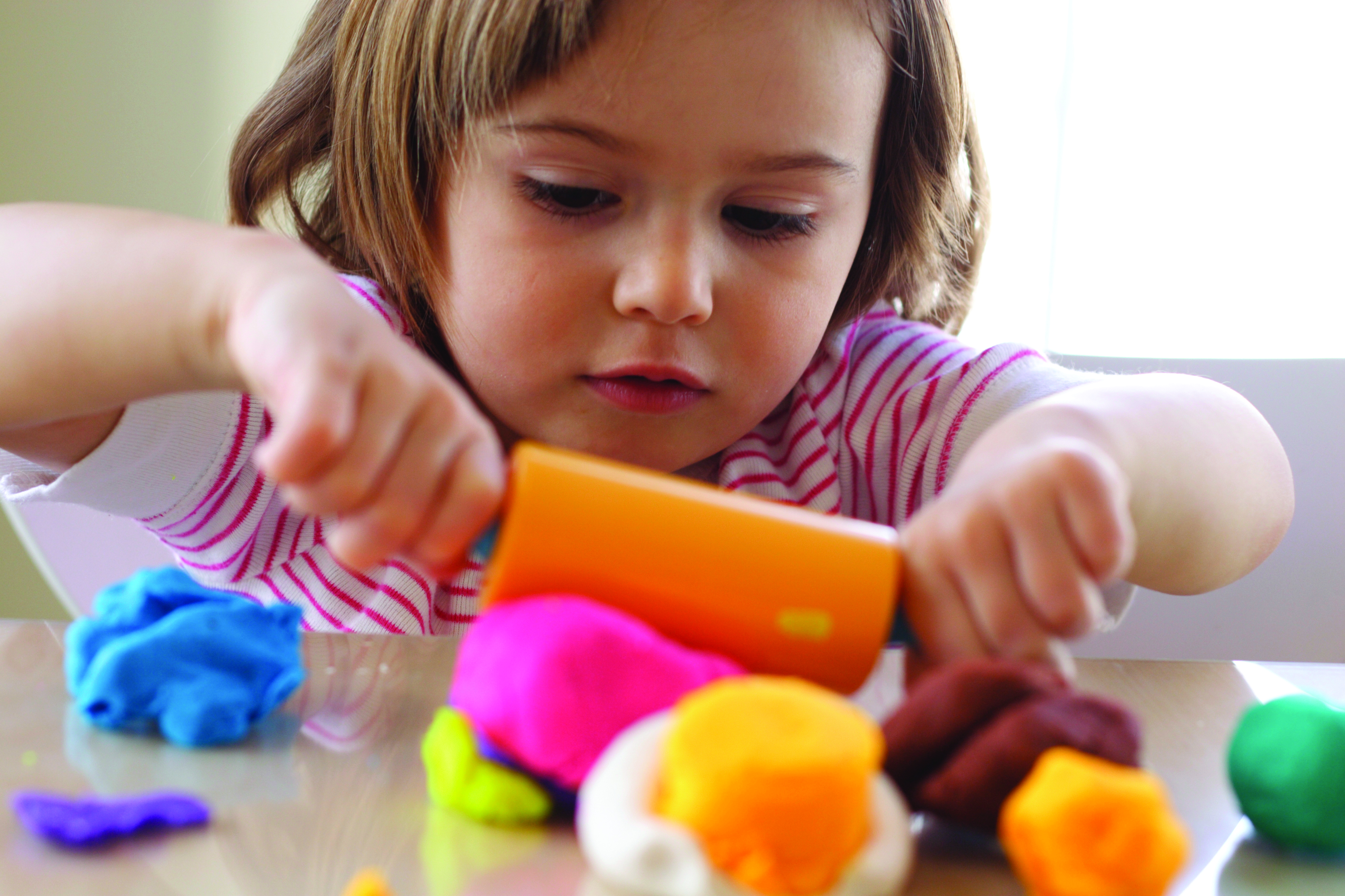 Young girl playing with Playdoh