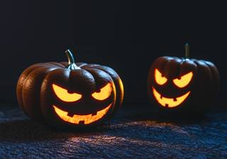 Two carved pumpkin faces